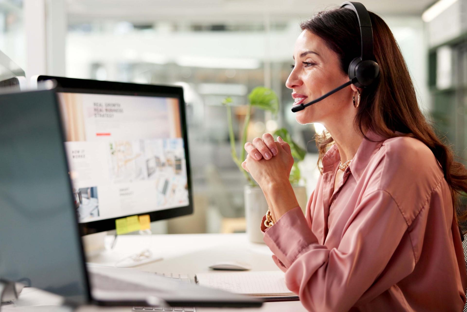 Woman, mic and computer screen at call center in office for crm, customer service and sales information. Girl, talking and headset for telemarketing, technical support and feedback with legal advice